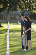 Family visiting cemetery together
