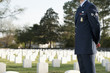 Caucasian soldier visiting cemetery