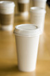 Row of disposable coffee cups