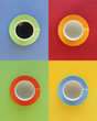 Modern, geometric array of four cups, one filled with coffee