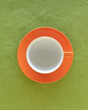 Empty coffee cup and saucer, top view