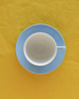 Empty coffee cup and saucer, top view