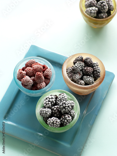 Photo: Cups of raspberries, marion berries and blackberry on serving tray Cups of raspberries, marion berries and blackberry on serving tray