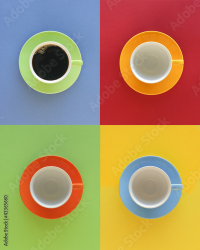 Photo: Modern, geometric array of four cups, one filled with coffee Modern, geometric array of four cups, one filled with coffee