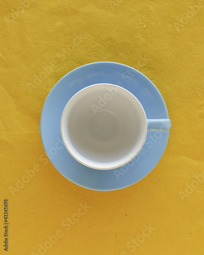 Photo: Empty coffee cup and saucer, top view Empty coffee cup and saucer, top view