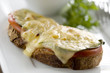 Swiss cheese meltdown served on toasted bread with tomatoes