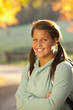 Smiling Caucasian teenager standing outdoors