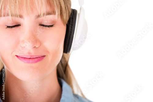 Photo: Woman listening to music Woman listening to music