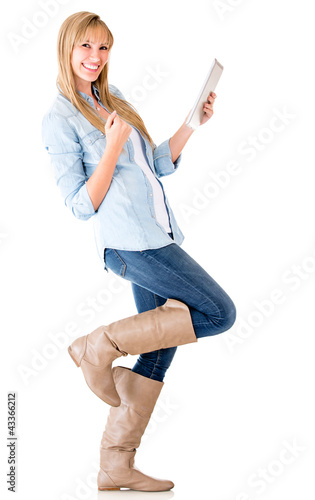 Foto: Happy woman with a tablet computer Happy woman with a tablet computer