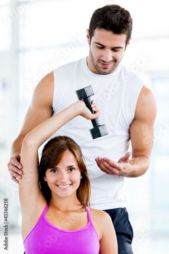 Photo: Fit woman with trainer Fit woman with trainer