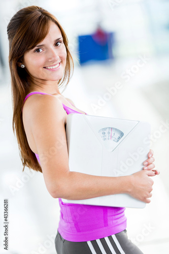 Photo: Woman loosing weight at the gym Woman loosing weight at the gym