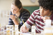 Teenage students studying in laboratory