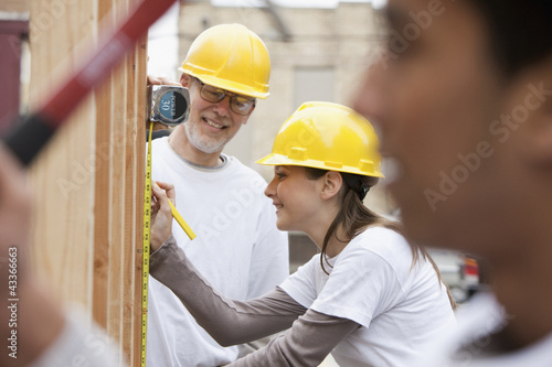 Photo: Volunteers working on construction site Volunteers working on construction site