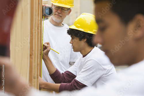 Photo: Volunteers working on construction site Volunteers working on construction site