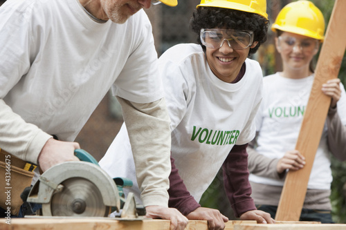 Photo: Volunteers working on construction site Volunteers working on construction site