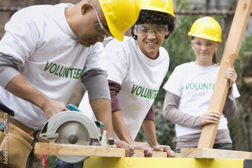 Photo: Volunteers working on construction site Volunteers working on construction site
