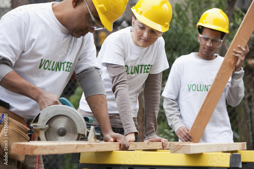 Photo: Volunteers working on construction site Volunteers working on construction site
