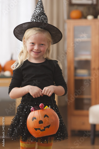 Photo: Caucasian girl in witch Halloween costume Caucasian girl in witch Halloween costume