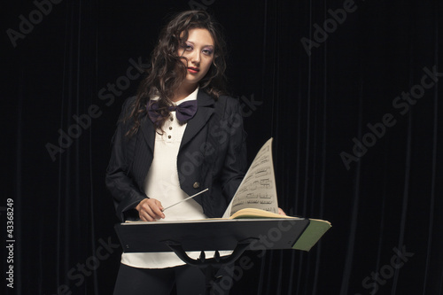 Photo: Serious mixed race conductor Serious mixed race conductor