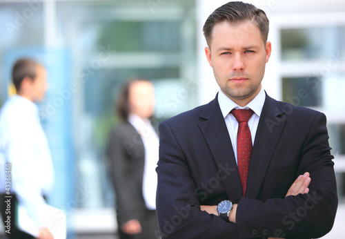 Photo: Happy smart business man in office Happy smart business man in office