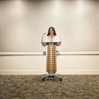 Japanese businesswoman standing at podium