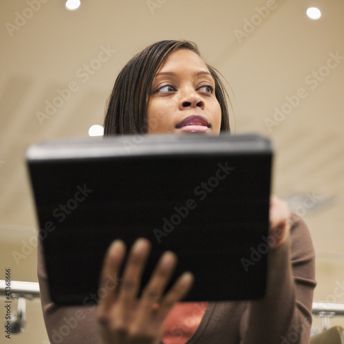 Photo: African American businesswoman using digital tablet African American businesswoman using digital tablet