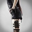 Trendy Caucasian woman with flask on leg