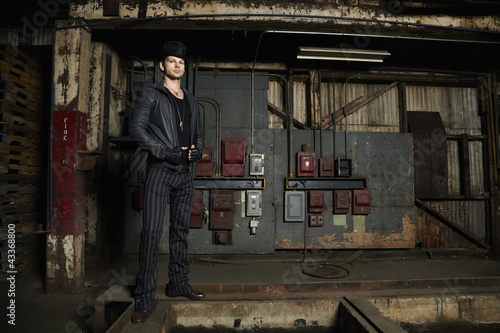 Photo: Trendy Caucasian man in warehouse Trendy Caucasian man in warehouse