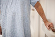Caucasian patient leaning on railing in hospital