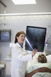Doctor explaining x-ray to patient in hospital