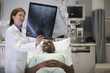 Doctor explaining x-ray to patient in hospital