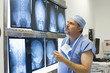 Doctor reviewing x-rays in hospital