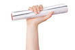 Human hand holds a rolled journal