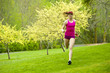 Mixed race woman running in park