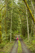 Mixed race woman running on remote path