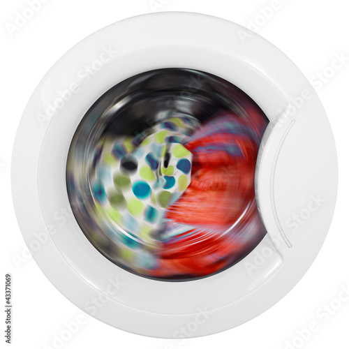 Photo: Washing machine door with rotating garments inside Washing machine door with rotating garments inside