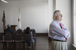 Businessman looking out window in meeting room