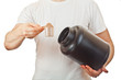 Photo: Man preparing protein shake with scoop of chocolate whey powder Man preparing protein shake with scoop of chocolate whey powder