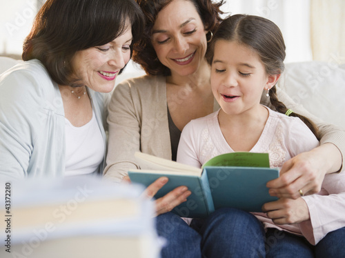 Photo: Family reading book together Family reading book together