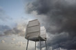 Voting booth against stormy sky