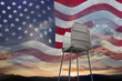Sunset and American flag behind voting booth