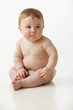Shy, chubby Caucasian baby boy