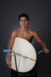 Foto: Teen Sitting on Bike with Surfboard Teen Sitting on Bike with Surfboard