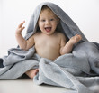 Caucasian baby boy wrapped in towel