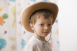 Caucasian boy wearing cowboy hat