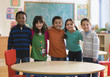 Students standing together in classroom