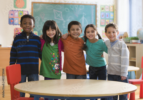 Photo: Students standing together in classroom Students standing together in classroom