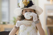 Hispanic girl in elegant dress drinking tea