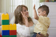Mother and son high fiving