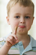 Caucasian boy with bandage on finger